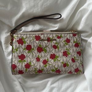Michael Kors monogram clutch wallet with flower design